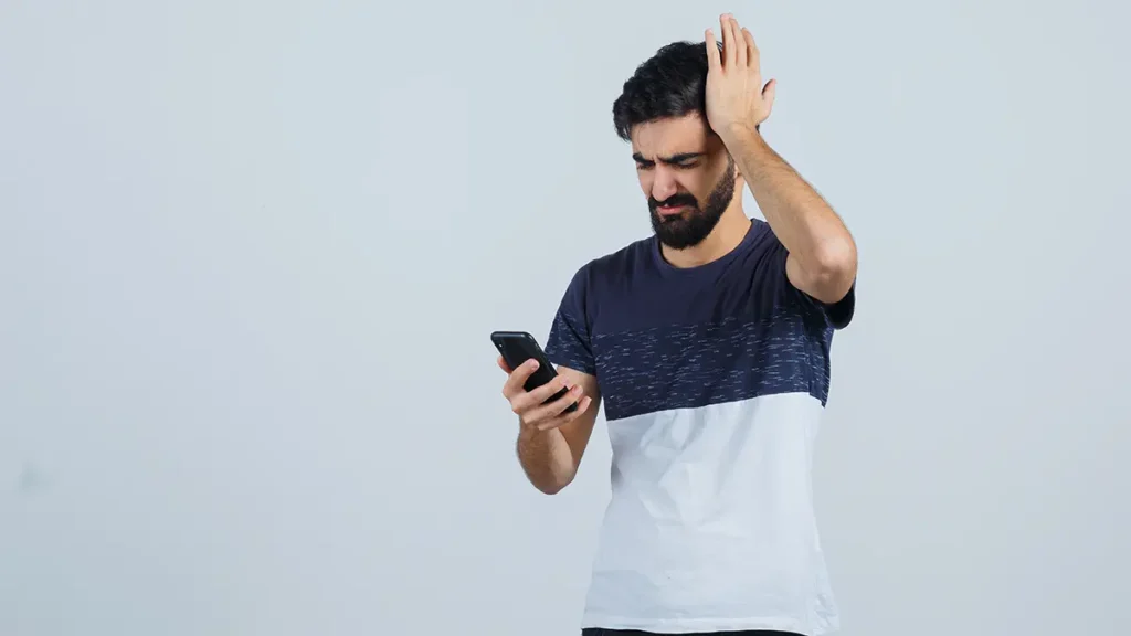 missed loan EMI alert on smartphone causing financial stress