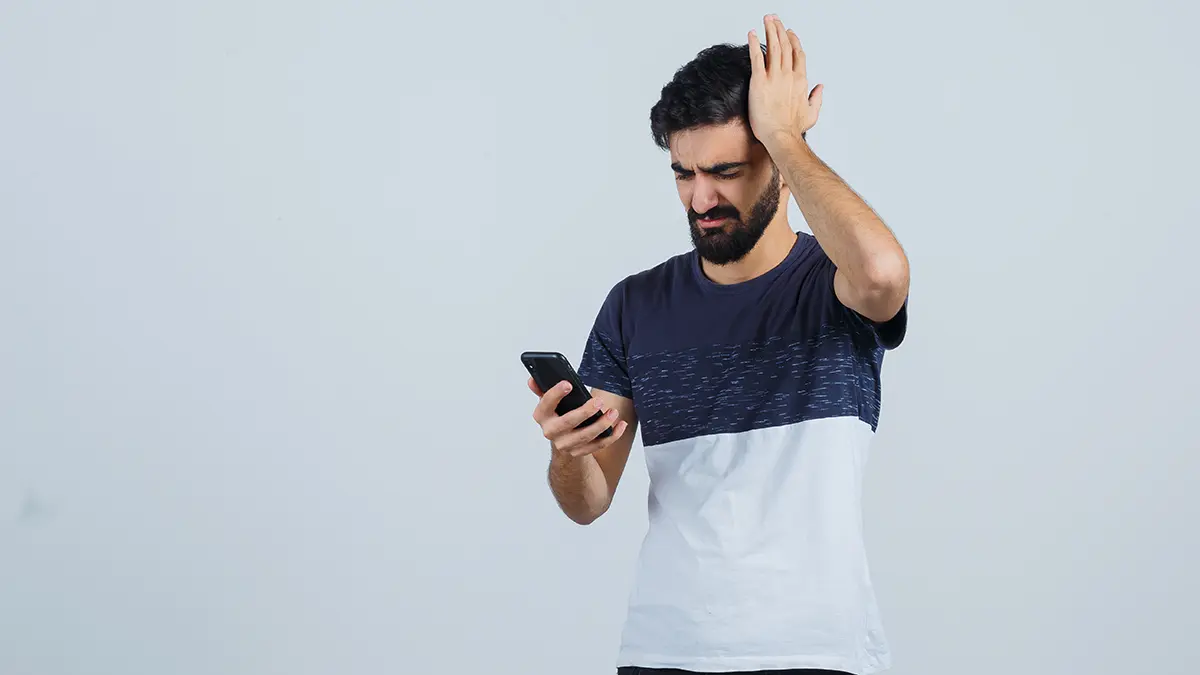 missed loan EMI alert on smartphone causing financial stress